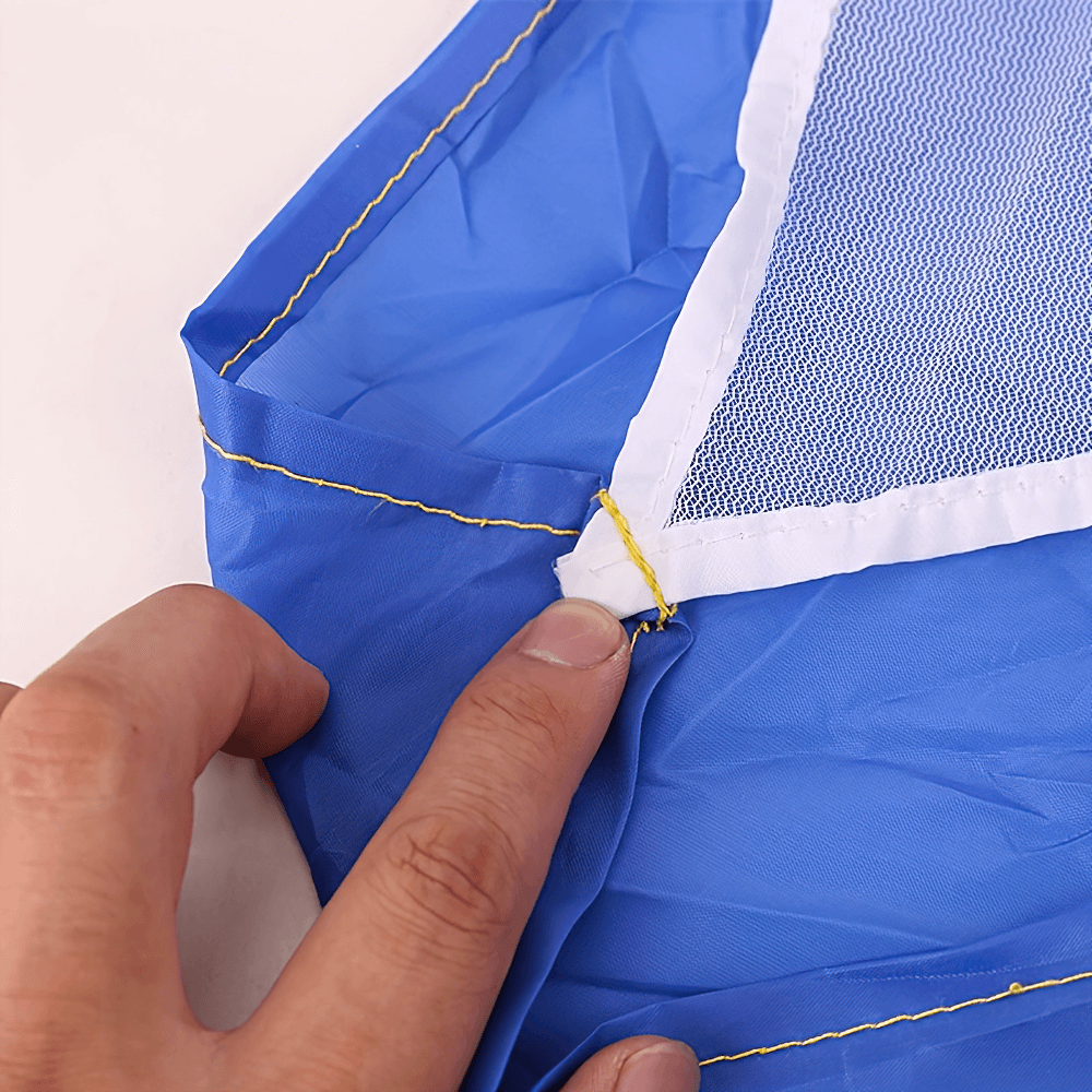 Close-up of a blue running resistance parachute showing detailed stitching and mesh design for agility training.