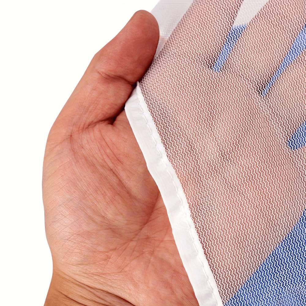 Close-up of hand holding a mesh fabric from a running resistance parachute, highlighting quality material for agility training.