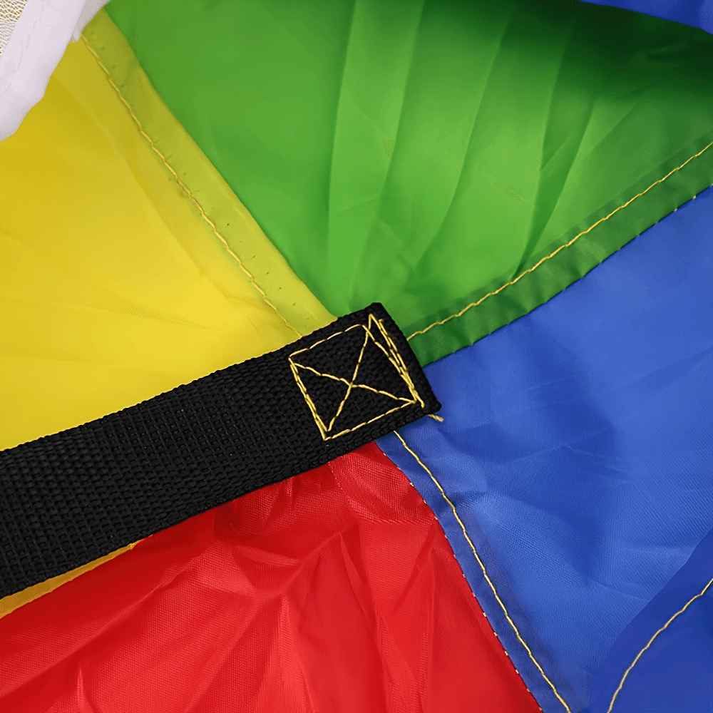 Close-up of rainbow resistance parachute fabric with strap, designed for speed and agility training.