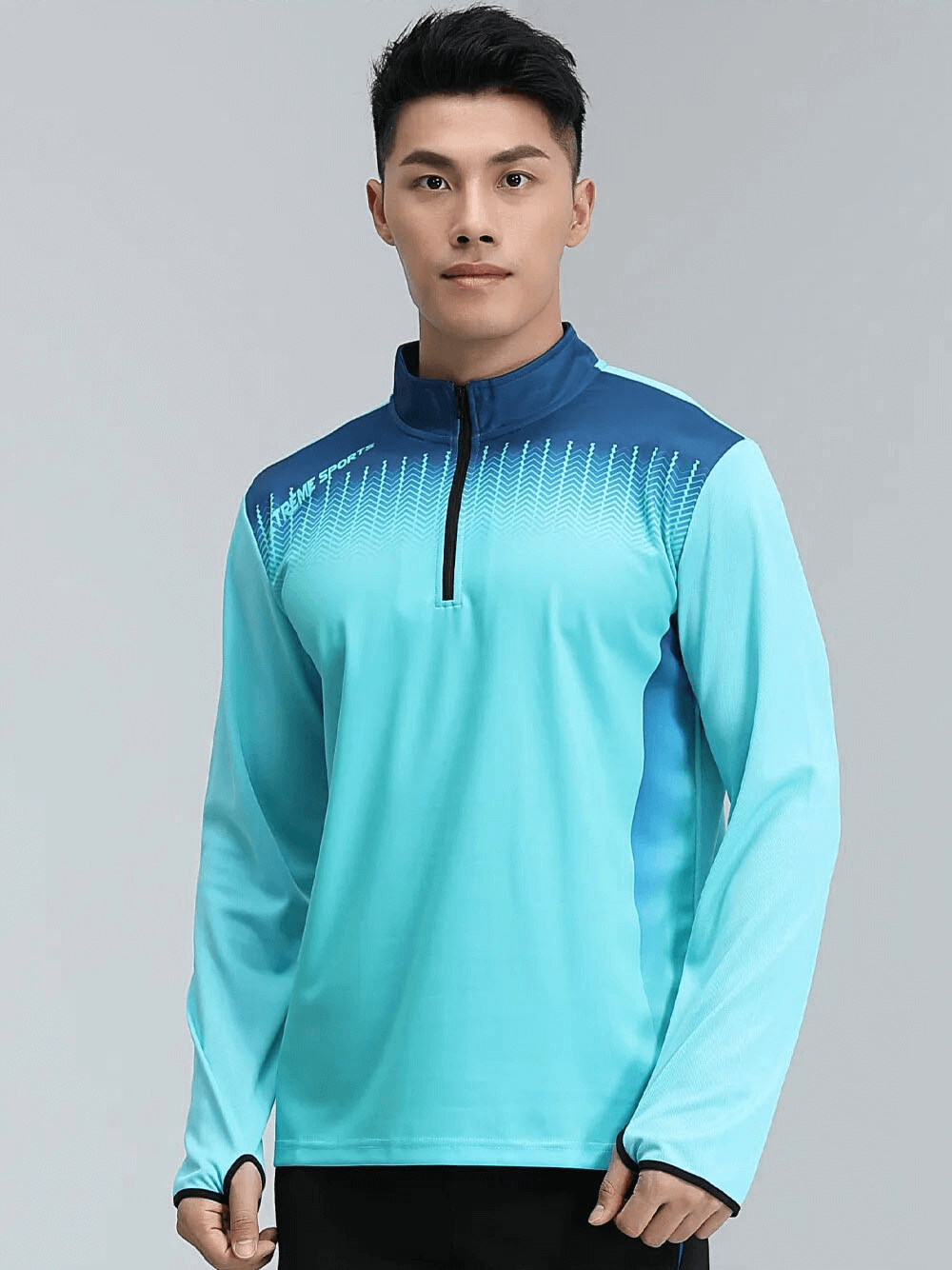 Man wearing a blue Running Half Zip Stand Collar Top with finger holes, ideal for high-intensity running, made of breathable spandex.