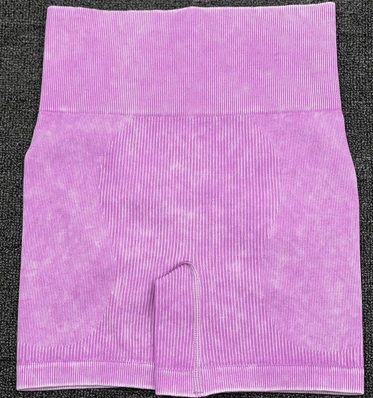 Seamless frosted yoga shorts in pink with striped pattern, made from breathable nylon and spandex. Perfect for stylish and eco-friendly workouts.