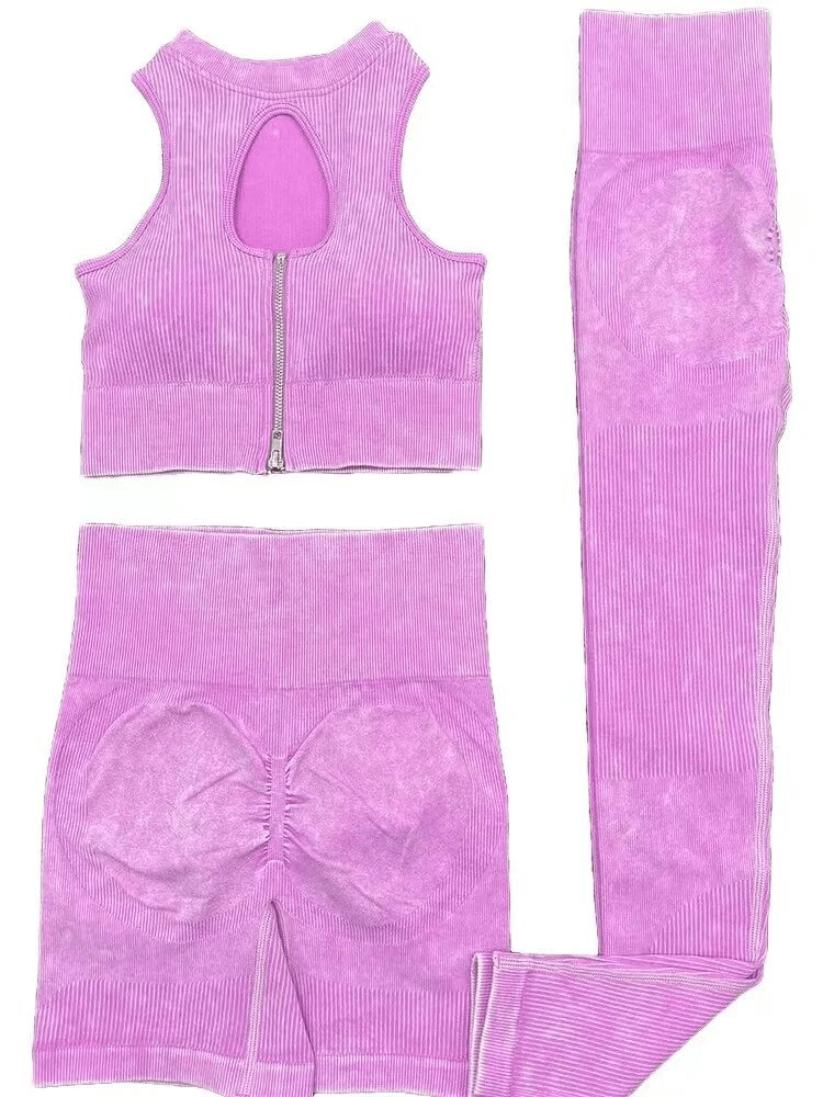 Seamless frosted yoga set with zipper crop top and leggings in purple, made from breathable nylon and spandex for eco-friendly workouts.