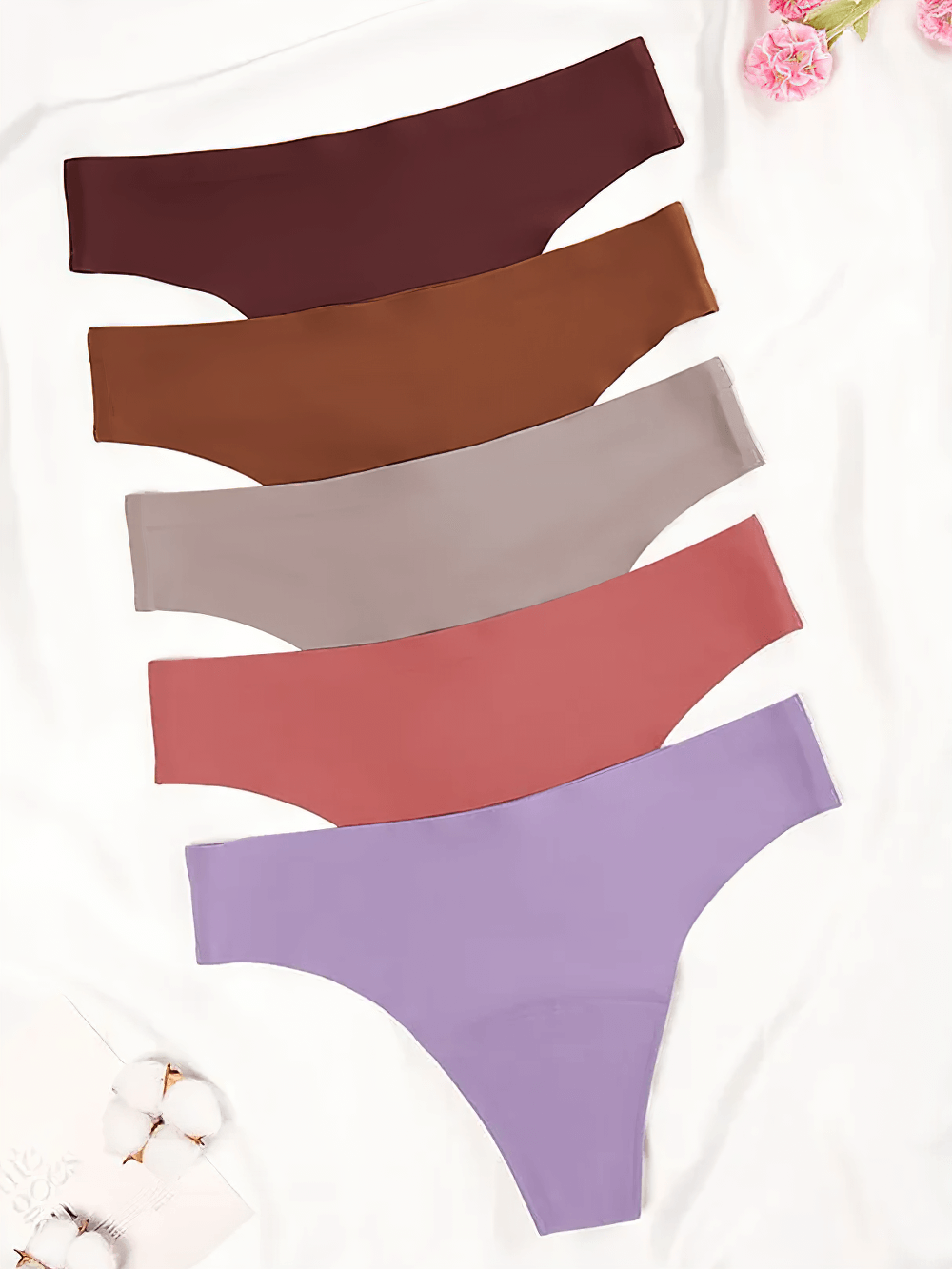 Colorful laser-cut seamless thongs with moisture-wicking fabric, featuring ergonomic design and elastic waistband for comfy wear.