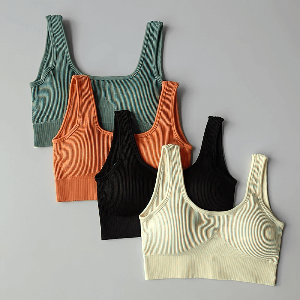 Four seamless ribbed sports bras in green, orange, black, and cream, perfect for yoga, pilates, and running; style SF2186.