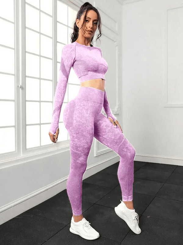 Woman wearing purple seamless set of high waist pants and long sleeved top, perfect for yoga sessions. Flexible and eco-friendly.