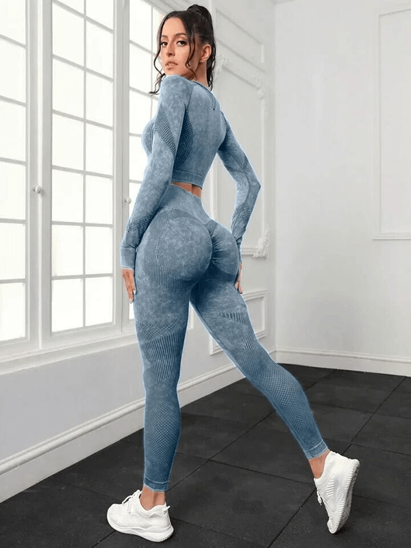 Woman in seamless high waist pants and long-sleeved top, ideal for yoga. Flexible, breathable, and eco-friendly activewear set.