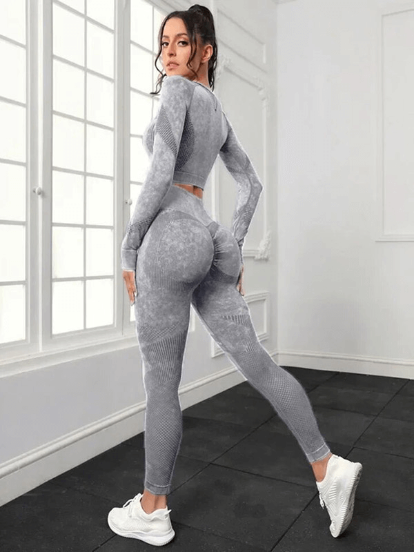Woman in a seamless high waist pants and long sleeved top set, ideal for yoga, features breathable, eco-friendly material.