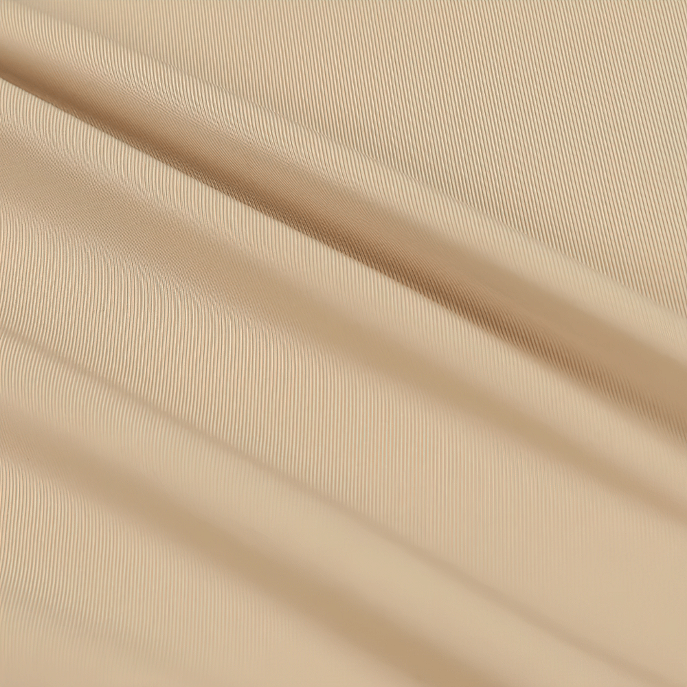 Close-up of beige seamless shaping boyshorts fabric showing smooth and stretchy texture for a slimming fit.