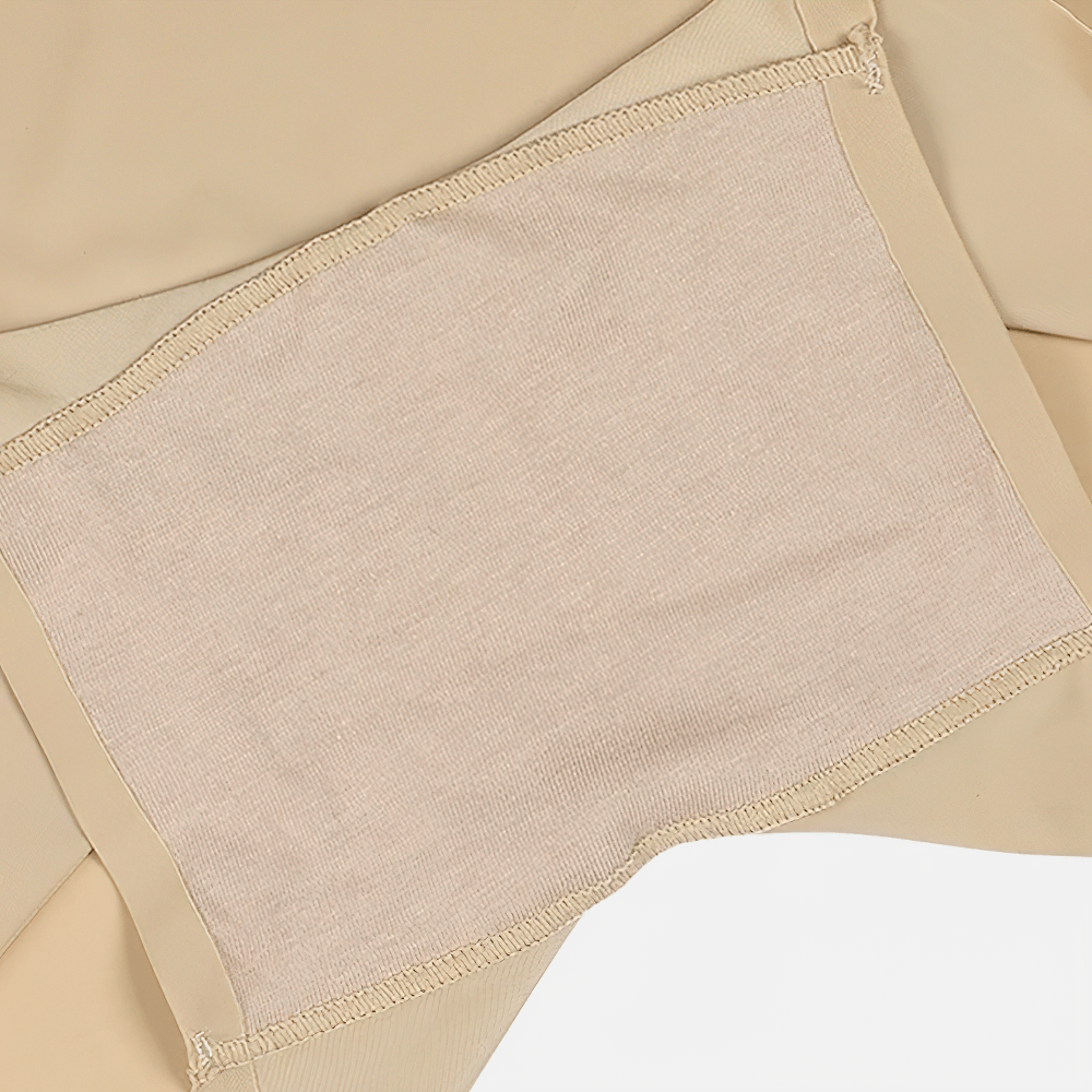 Close-up of seamless beige shaping boyshorts with stretchable fabric.