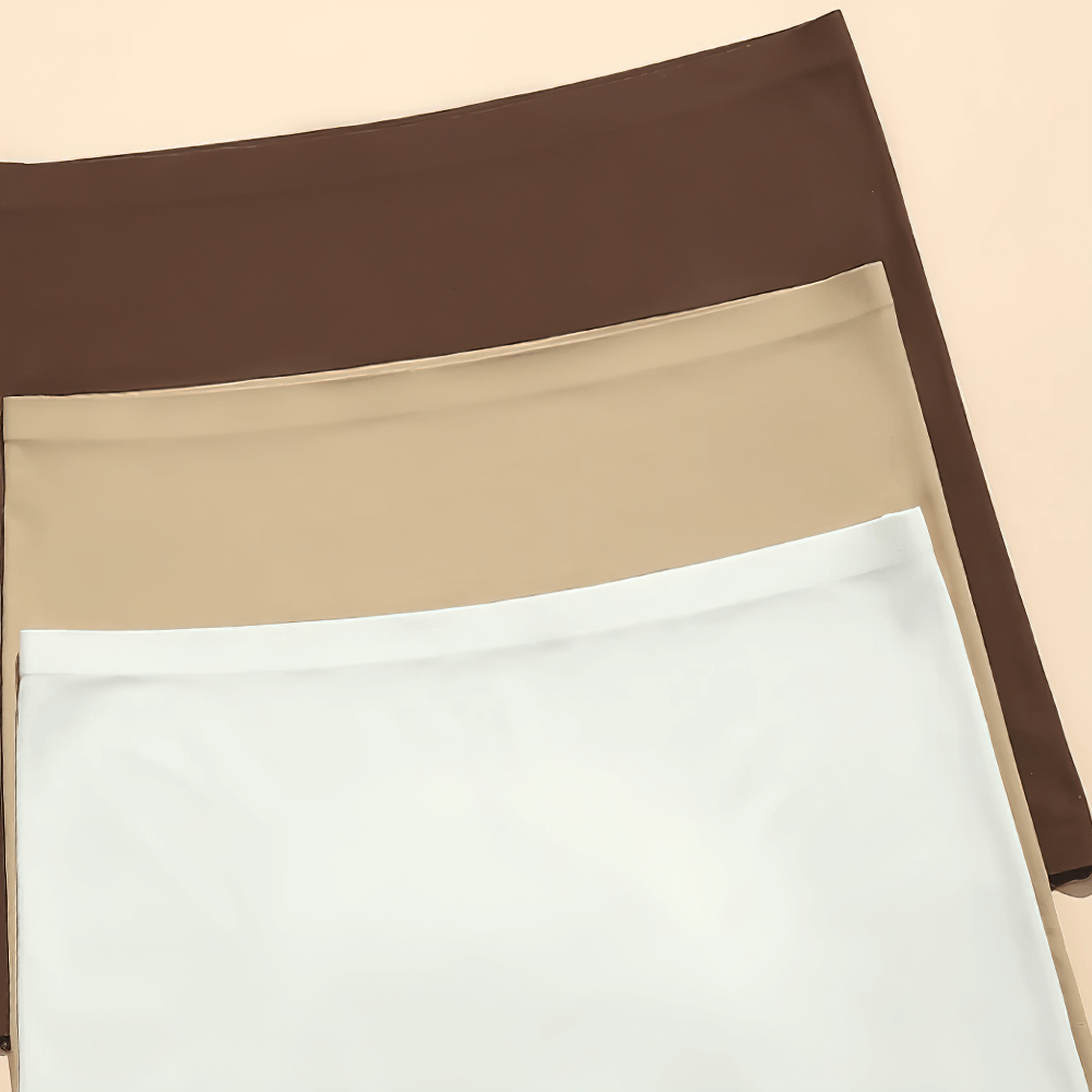 Three pairs of seamless high-waist boyshorts in brown, beige, and white, designed for slimming and smoothing under any outfit.