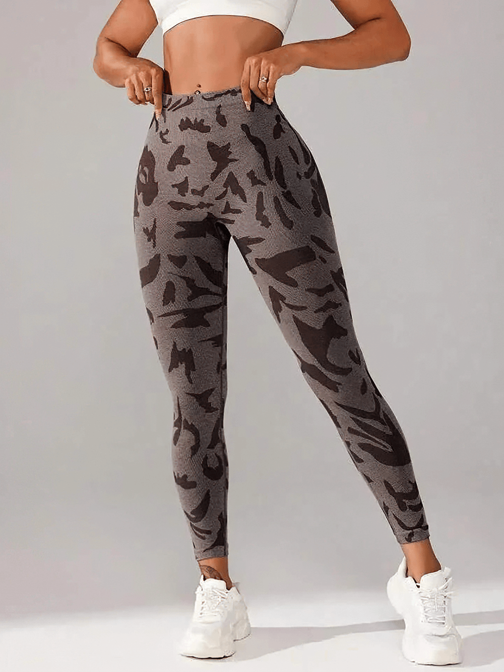 Woman wearing Seamless V-Waist Camo Yoga Leggings with Scrunch - SF4010, perfect for workouts and yoga, featuring a bold pattern.