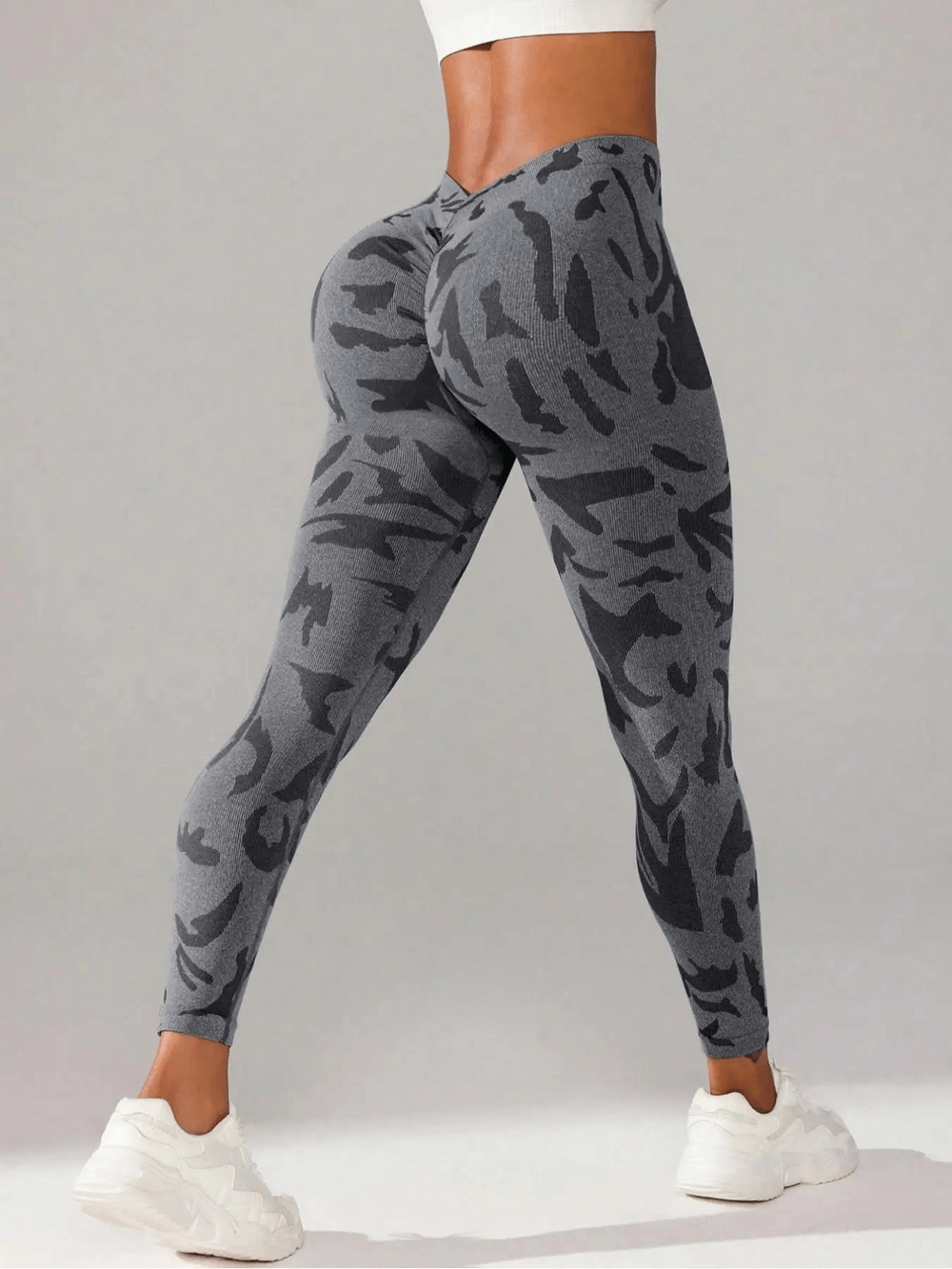 Woman wearing Seamless V-Waist Camo Yoga Leggings with Scrunch - SF4010 in gray tie dye, showing off fit and style for gym.