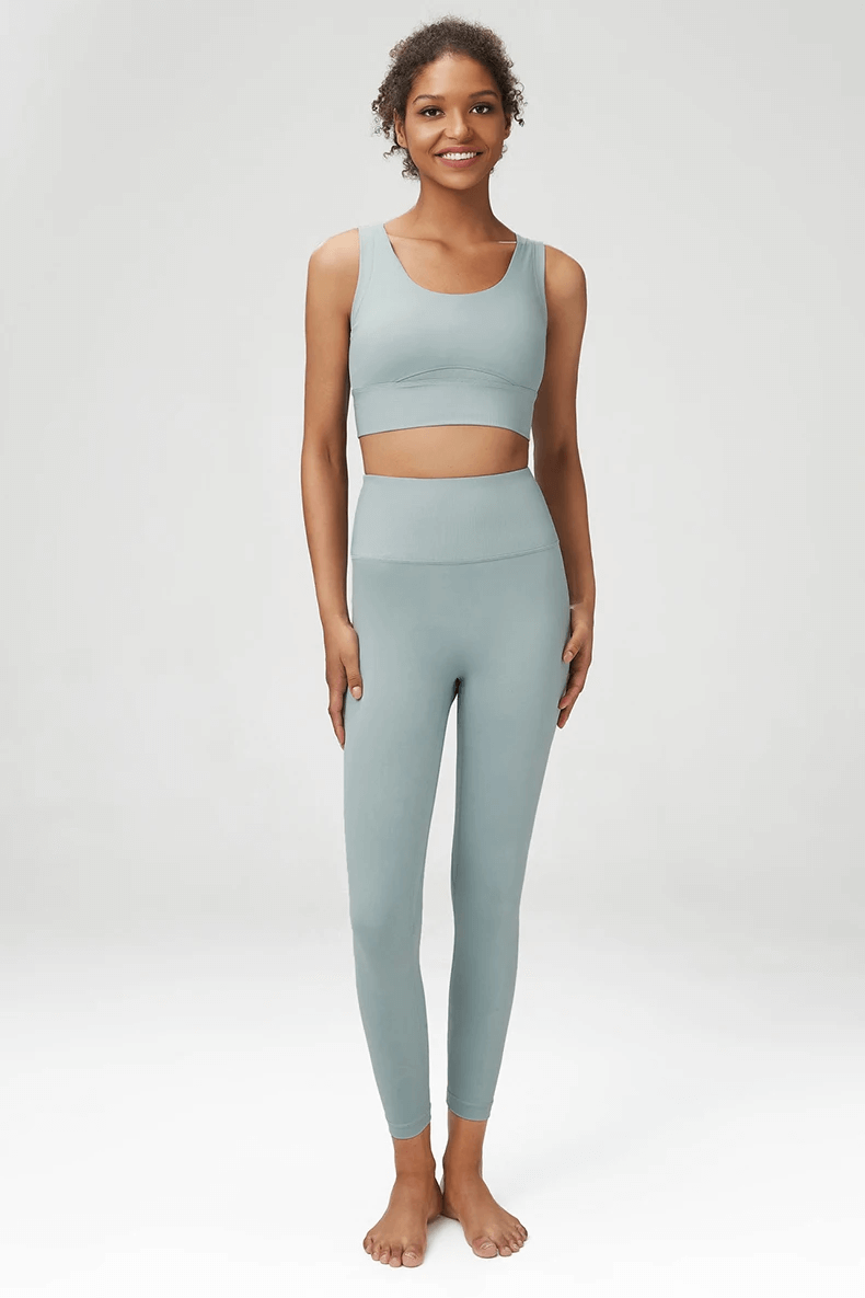 Modern seamless yoga gear set in serene blue featuring sports bra and leggings - perfect for active women and fitness activities.