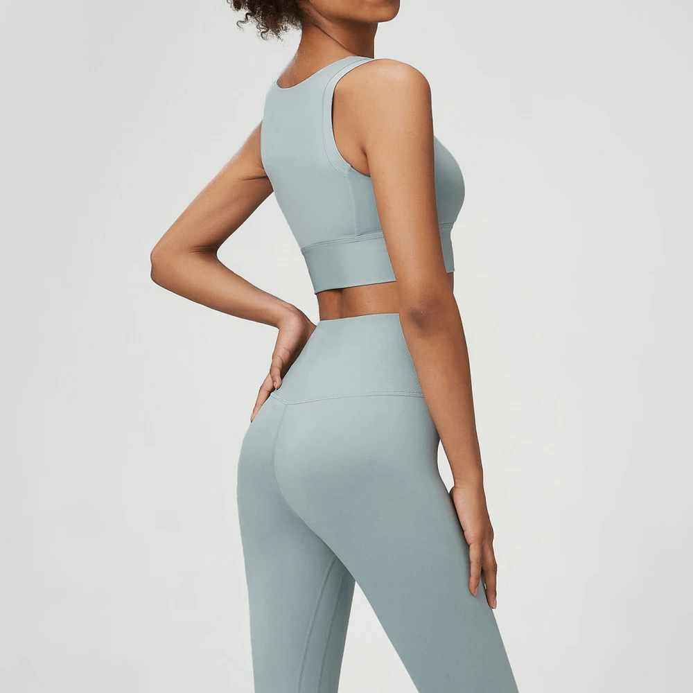 Woman wearing blue seamless yoga gear set, showing back view. Perfect for active lifestyles in yoga or fitness. Product code: SF2086.