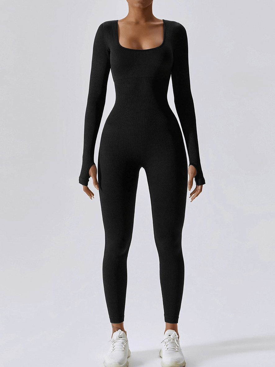 Seamless yoga suit with thumb holes on sleeves for women, perfect for fitness or athleisure, shown in sleek black design, item SF1287