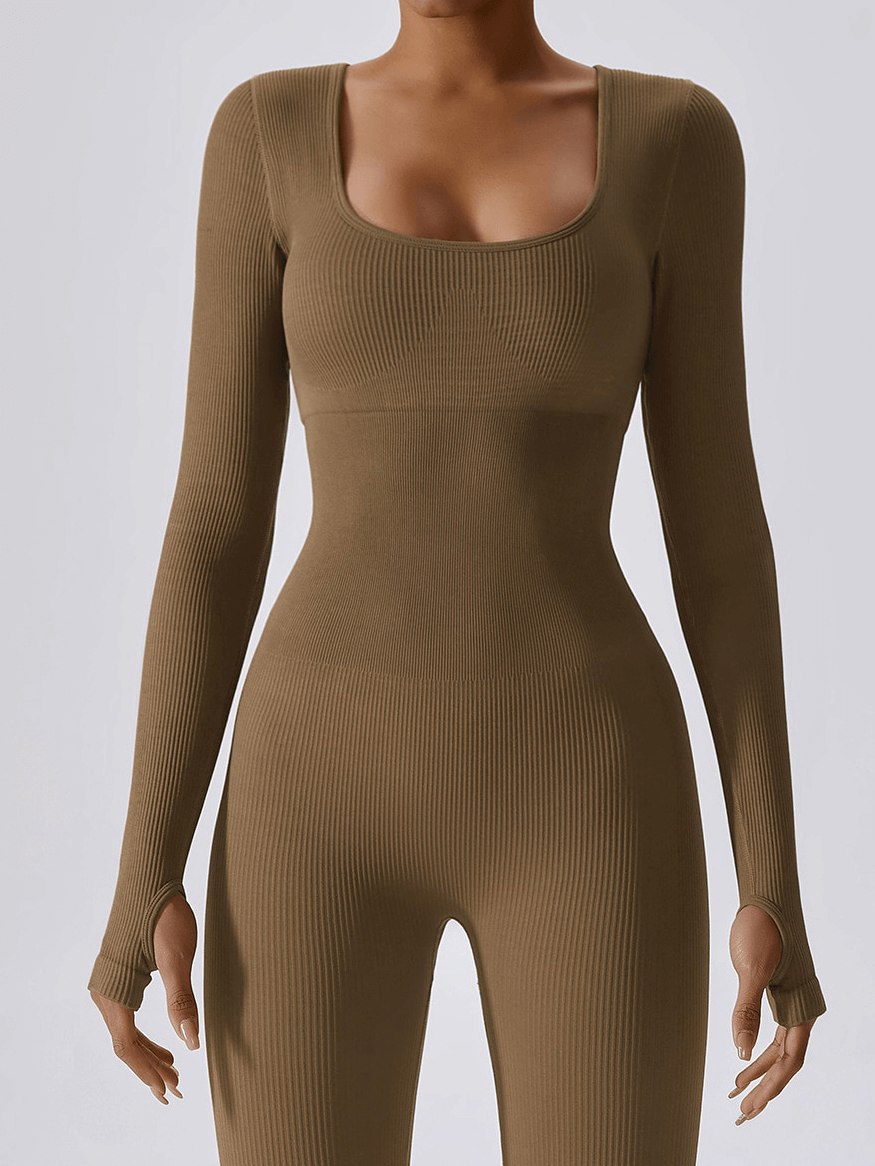 Seamless yoga suit with thumb holes on sleeves for women, perfect for fitness, yoga, gym; offers flattering fit and unrestricted movement.