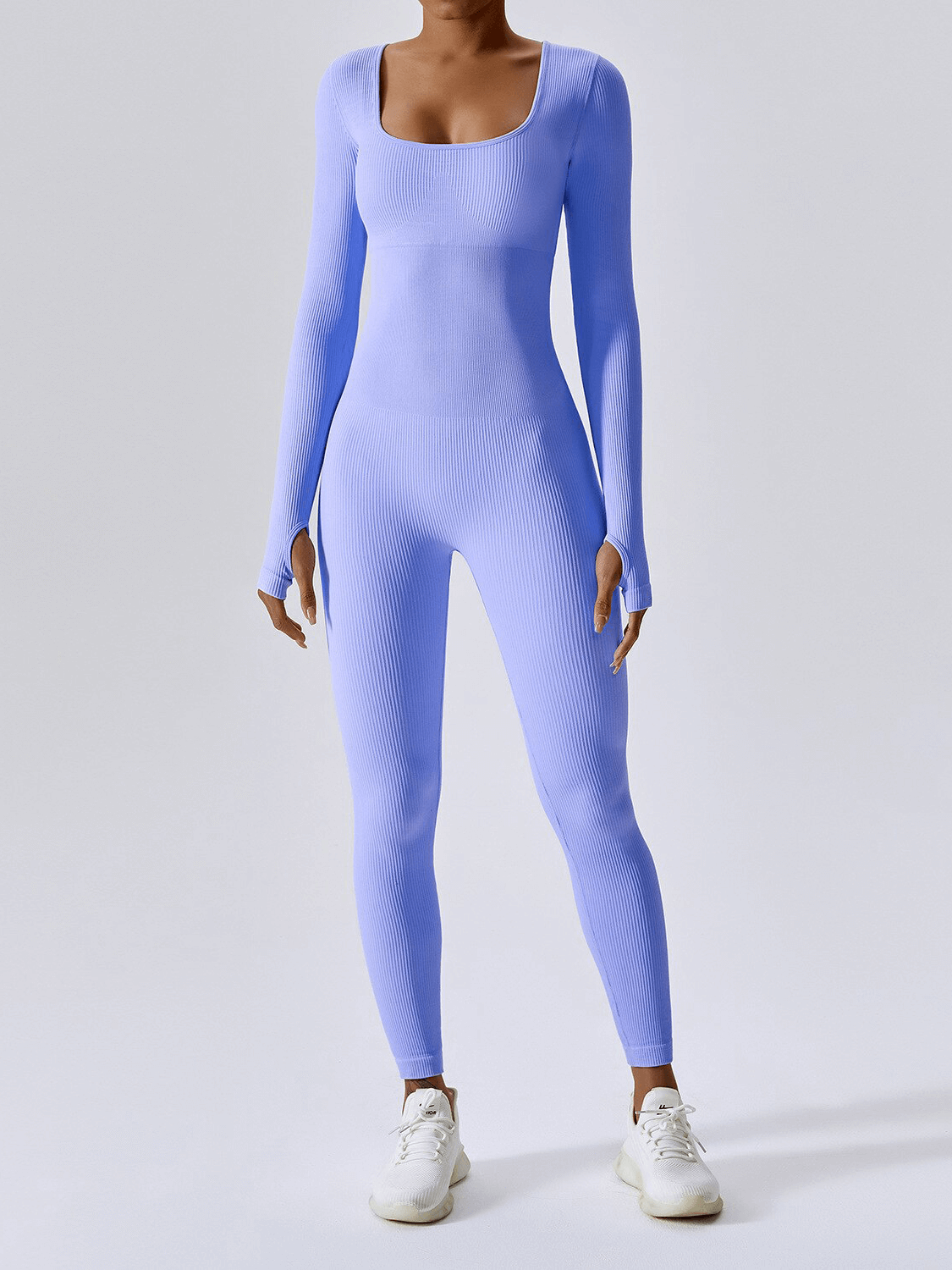 Woman wearing seamless yoga suit with thumb holes, blue fitness jumpsuit for women, activewear for gym or yoga, product code SF1287