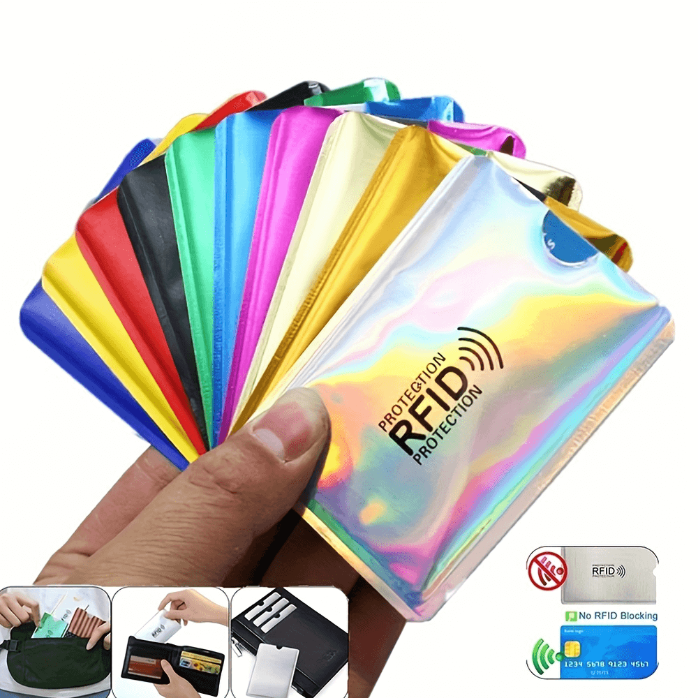 Hand holding colorful ultrathin RFID blocking card sleeves for secure anti-theft protection.