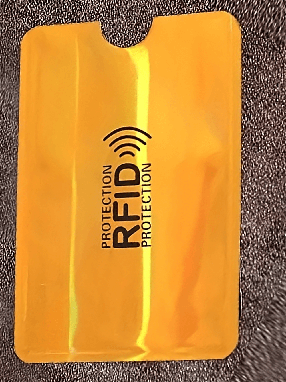 Secure Ultrathin RFID Blocking Card Sleeve, yellow RFID shield for anti-theft credit card protection, durable and slim design.