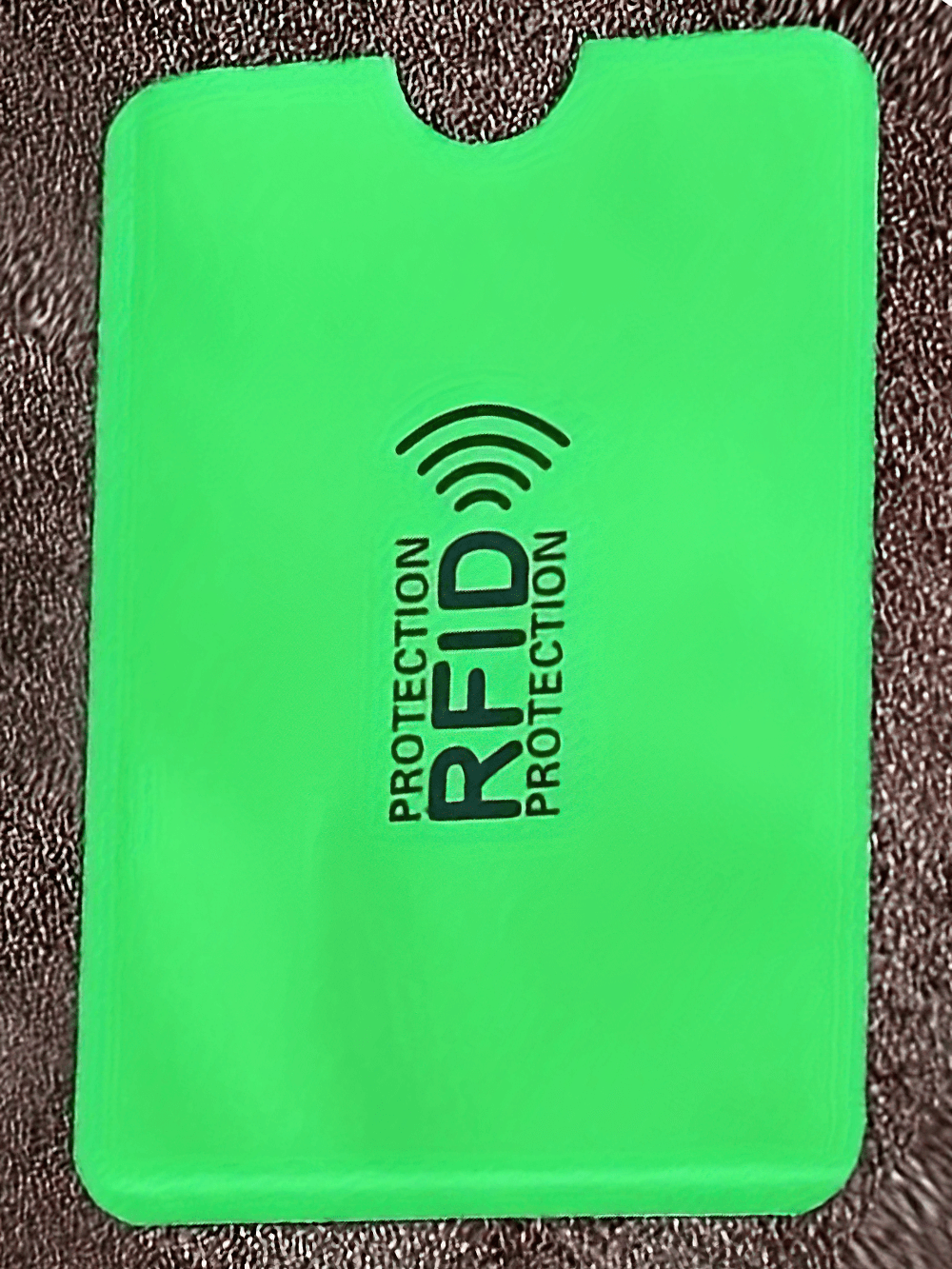 Green RFID blocking card sleeve for secure credit card protection with ultrathin design and anti-theft technology.