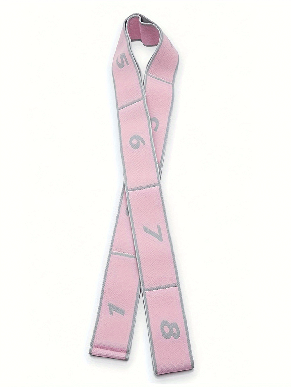 Pink yoga stretch band segmented with numbers for flexibility and strength training.