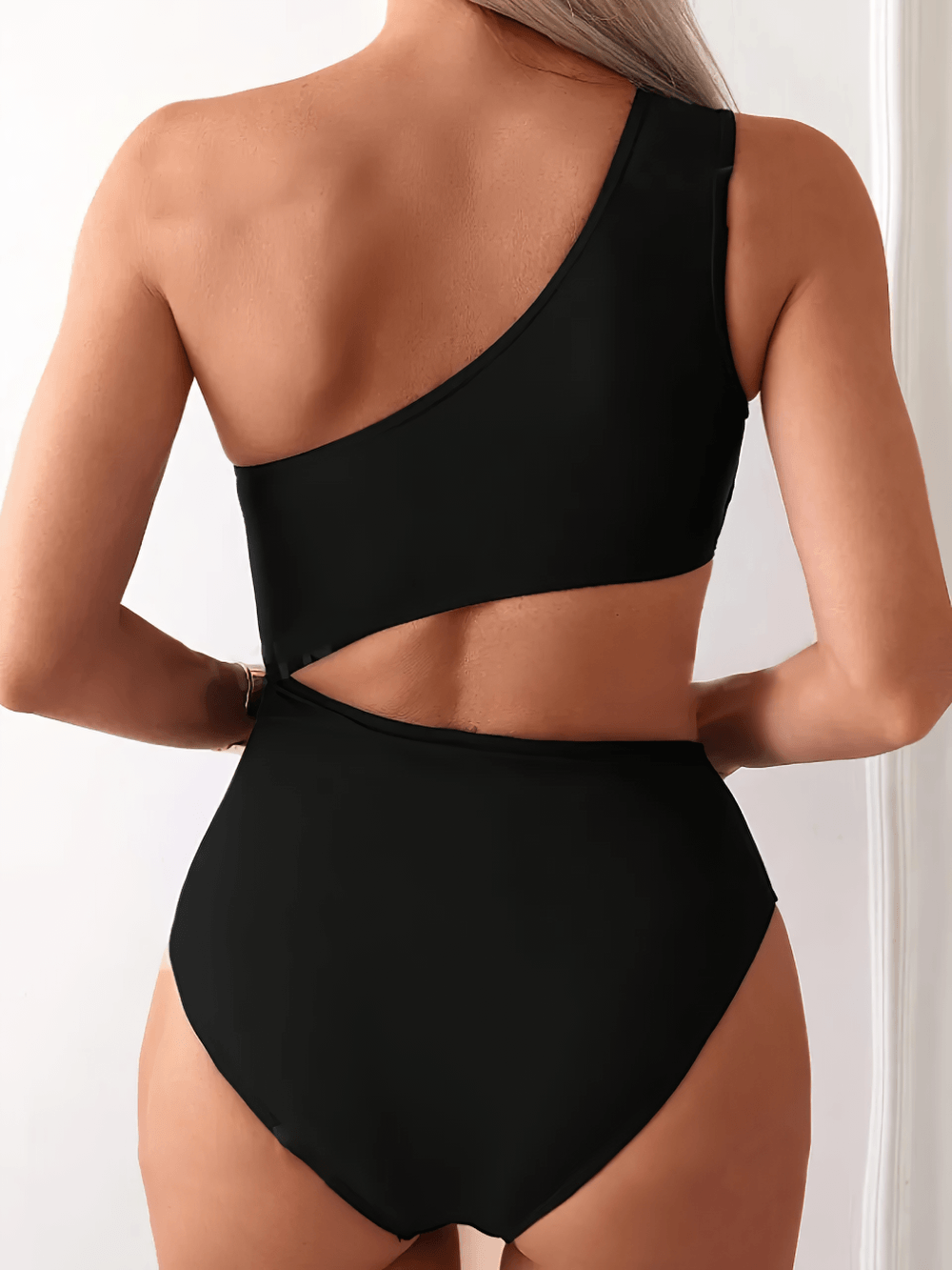 Sexy Asymmetric One Shoulder Cutout Swimsuit - SF4651 showcased from the back, highlighting its stylish cutout design.
