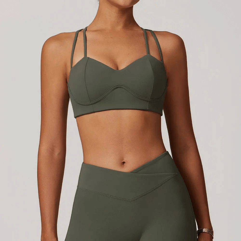 Stylish criss-cross strap sports bra for high support, perfect for workouts and yoga, made with breathable quick-dry fabric.