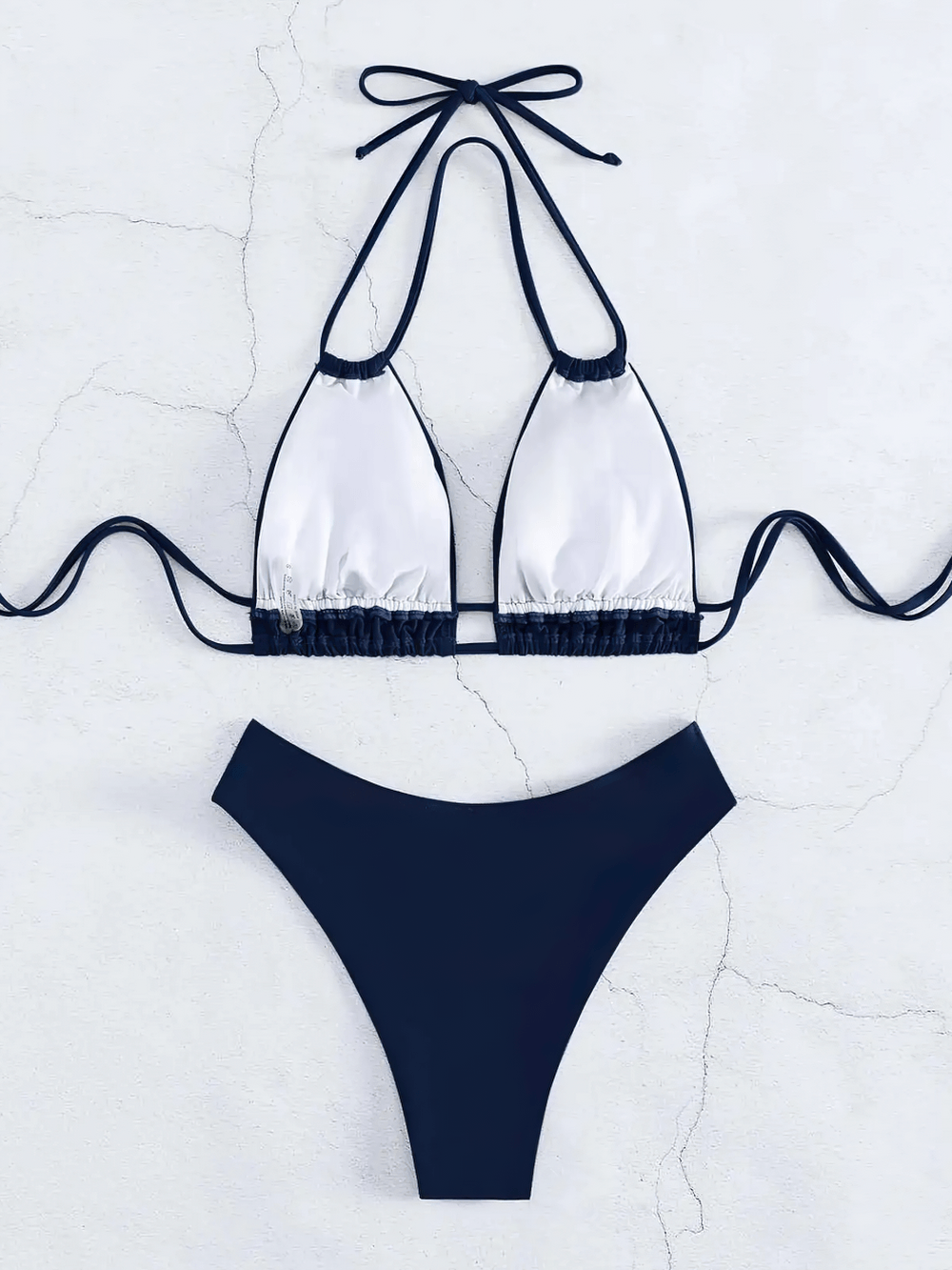 Sexy Lace-Up Halter Bikini Set With High Waist - SF4730 featuring a sleek halter top and high-waist bottom on a textured background.
