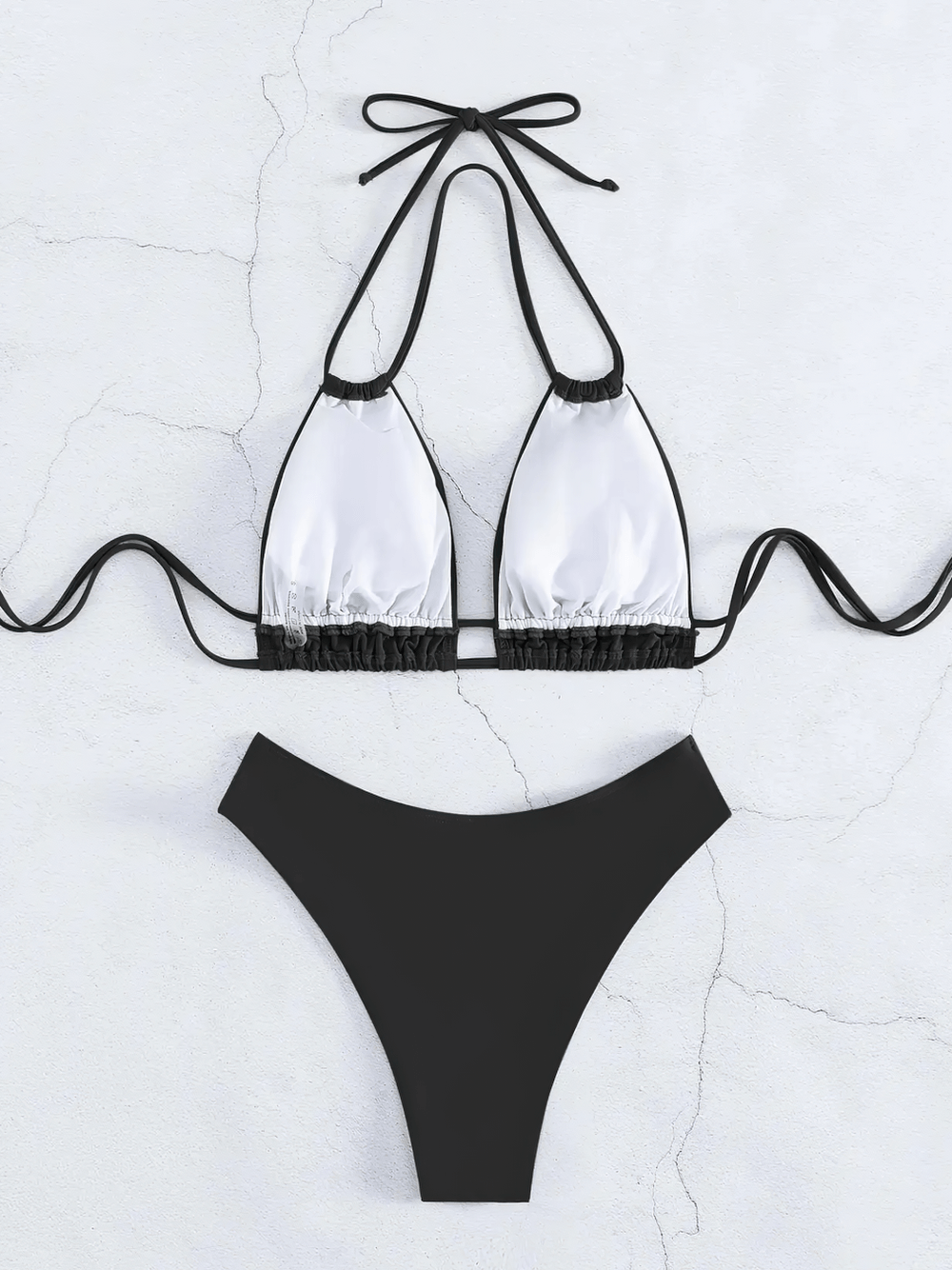 Sexy Lace-Up Halter Bikini Set With High Waist - SF4730 featuring a chic black and white design, perfect for sunny beach days.