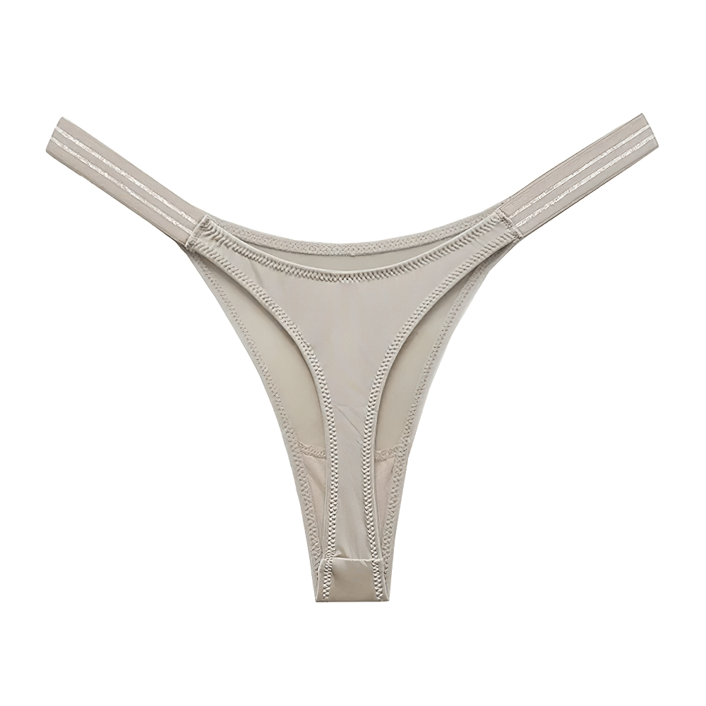 Stylish low-rise G-string panties in beige with knit design, crafted from polyester, nylon, and spandex for a sleek and durable fit.