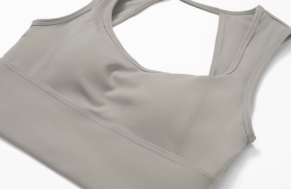 Gray open-back shockproof sports tank top made of nylon and spandex for women, ideal for running and gym workouts.