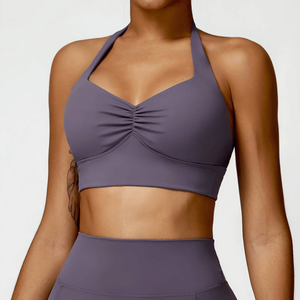 Stylish racerback sports bra with padded support, perfect for yoga, running, or gym sessions. Versatile, comfortable, and secure fit.