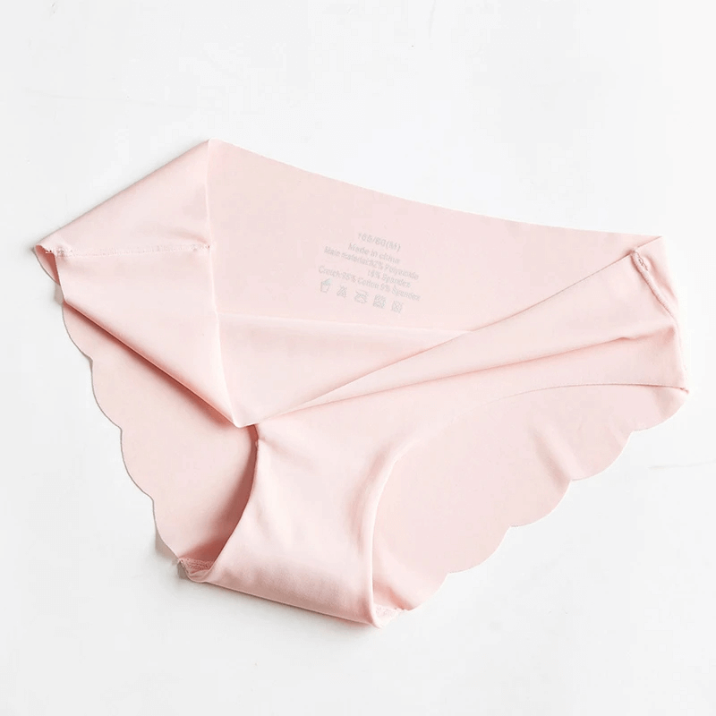 Soft pink seamless ice silk women's panties with scalloped edges, perfect for a smooth, invisible fit under clothes.