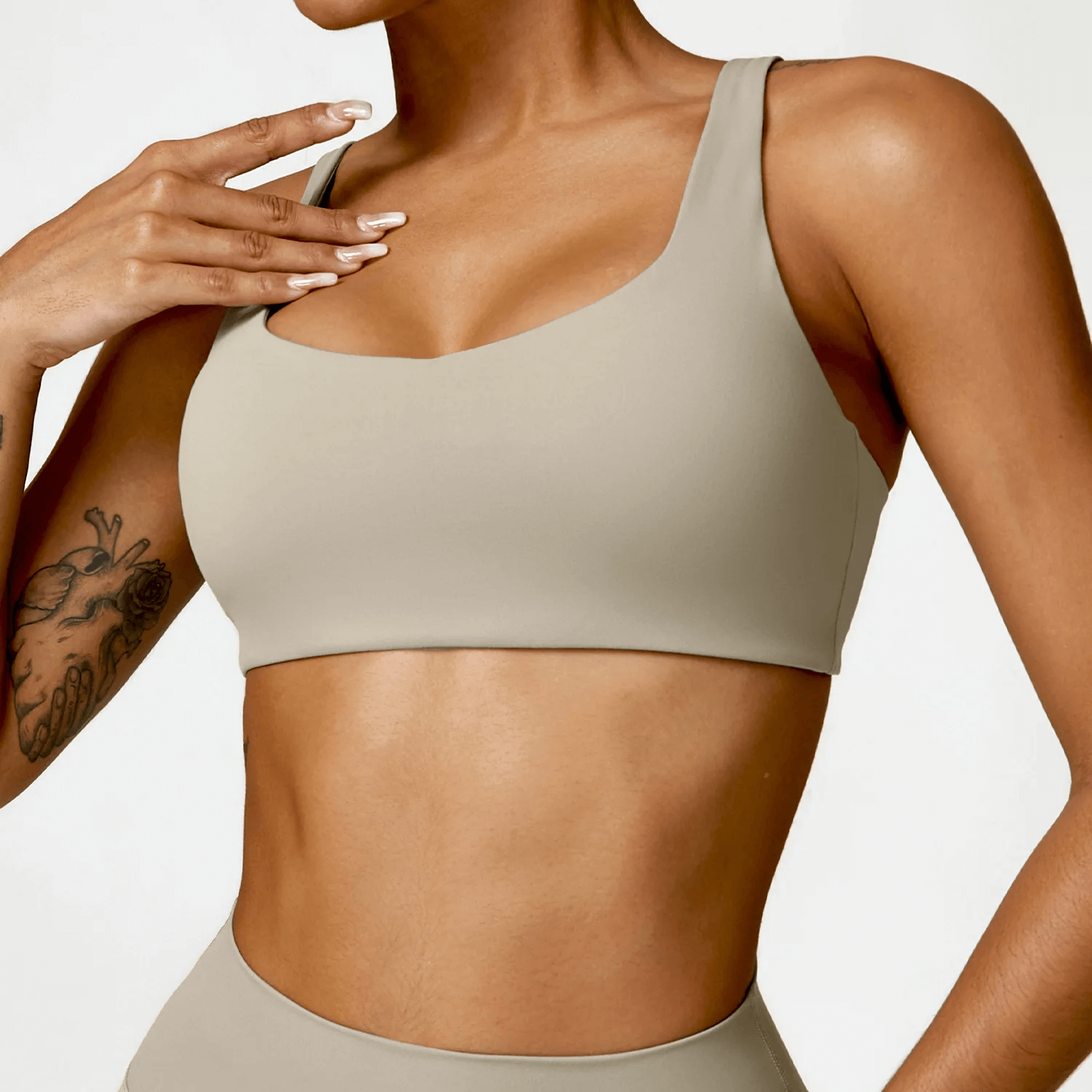 Sexy strappy sports bra with square neckline, offering breathable comfort and medium support for yoga or fitness.