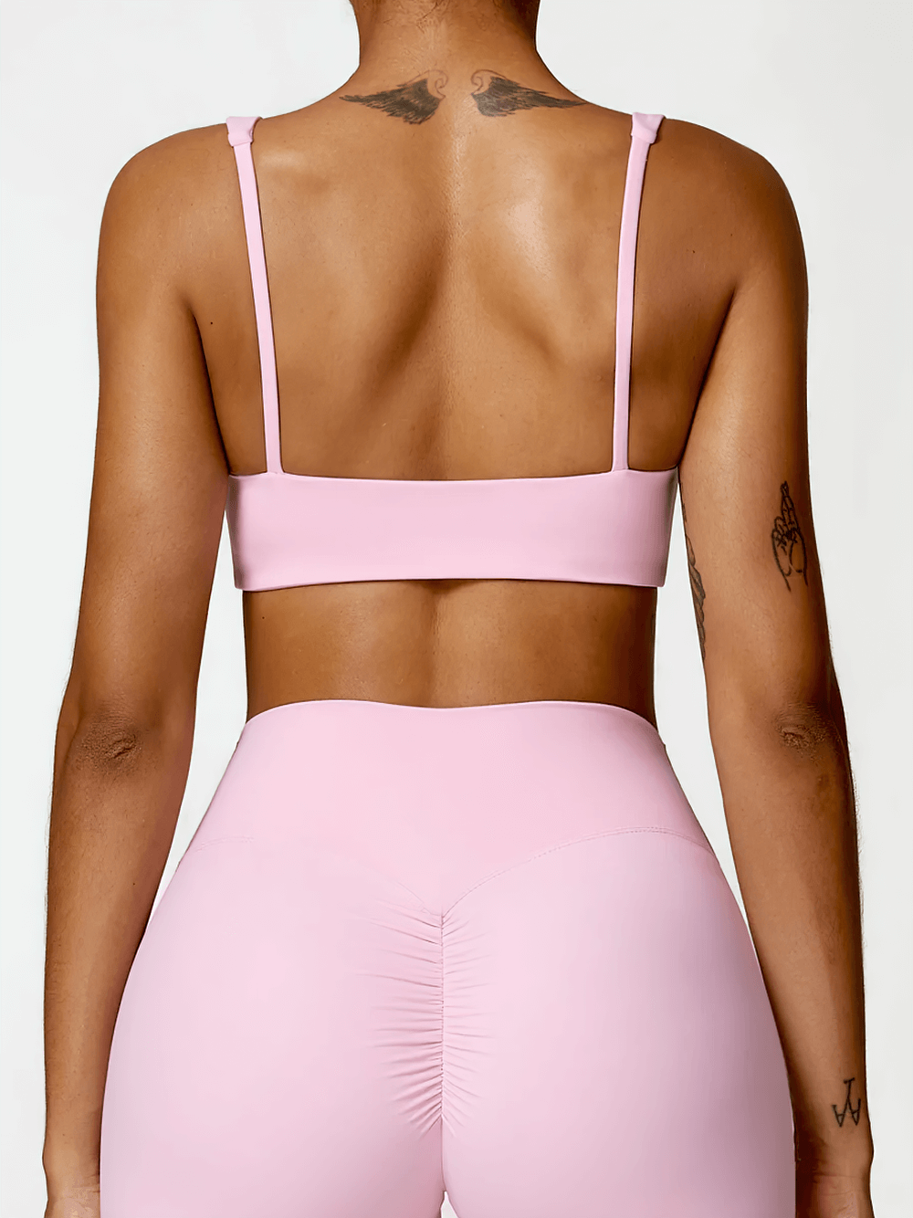 Back view of Sexy Strappy Sports Bra with square neckline, highlighting supportive straps and sleek design for yoga and fitness. SF2458