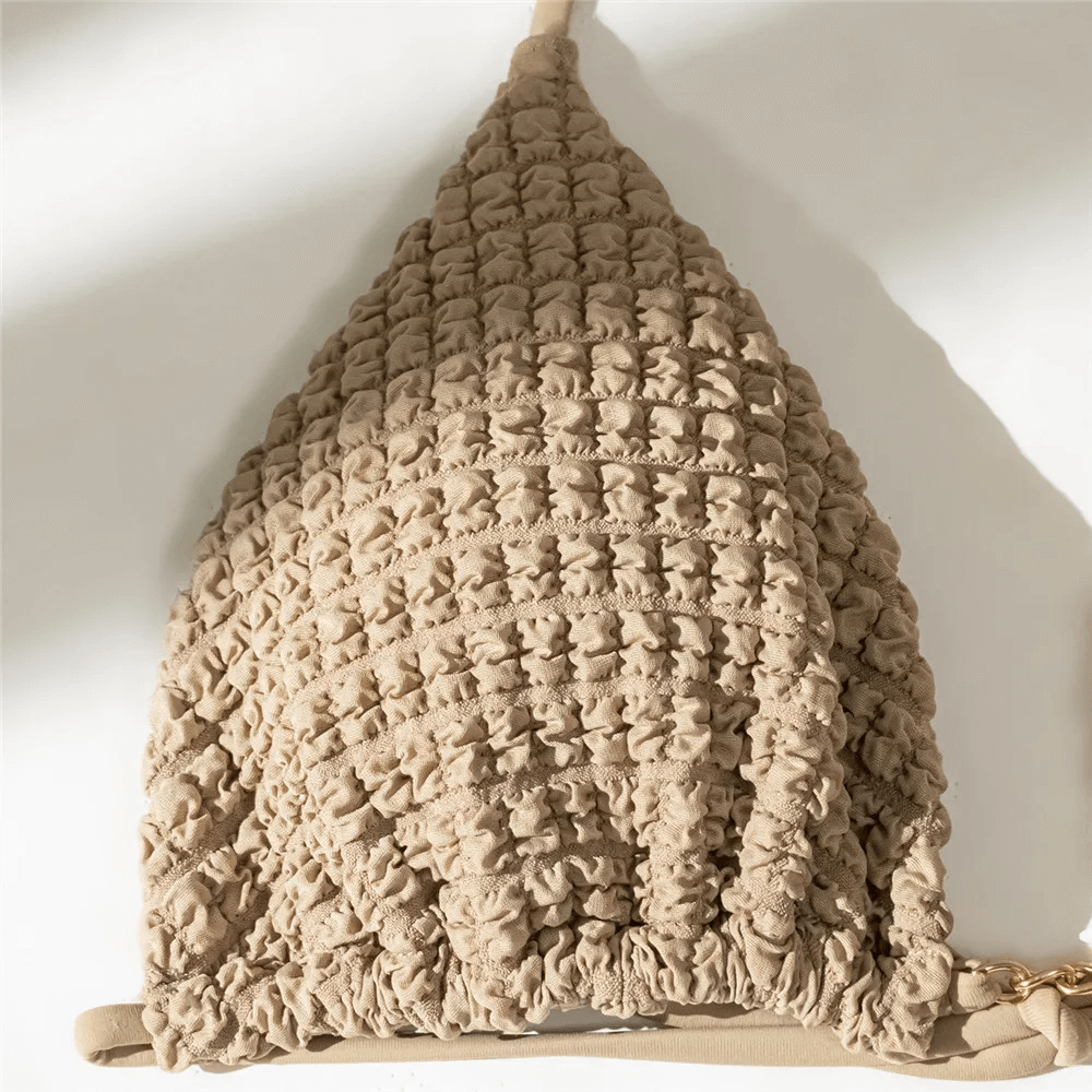 Textured halter bikini top in neutral tones, part of a chic three-piece swimsuit set SF2139, perfect for beach days.