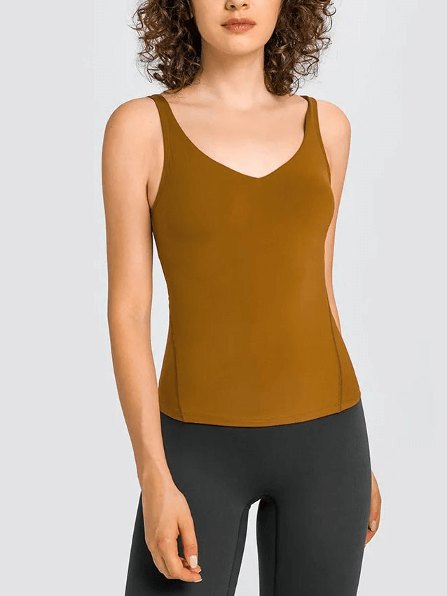 Model wearing brown sexy V-neck yoga sports tank top with padded bras, perfect for workout comfort and style.