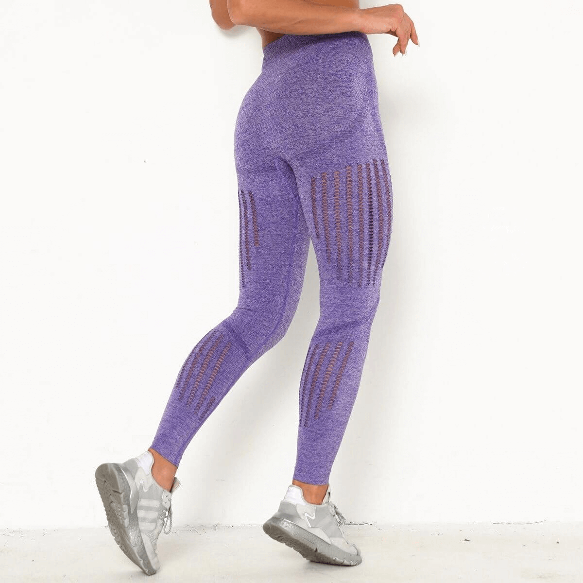Purple high-waist seamless leggings with booty-lifting design for women, shown from the back, highlighting comfort and fit.