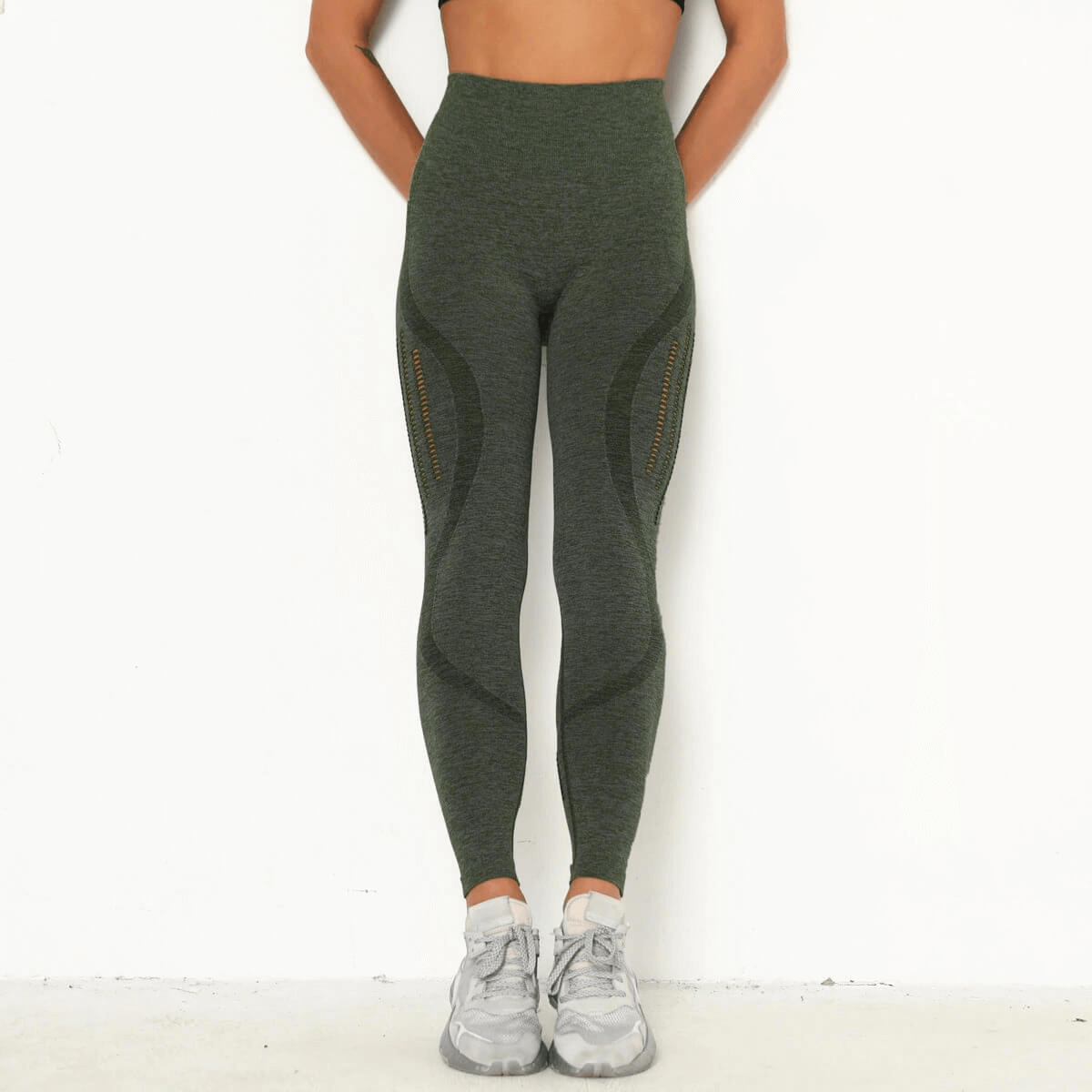 Sexy women's high-waist seamless leggings in green, showcasing a slim-fit and comfortable design, perfect for casual wear.