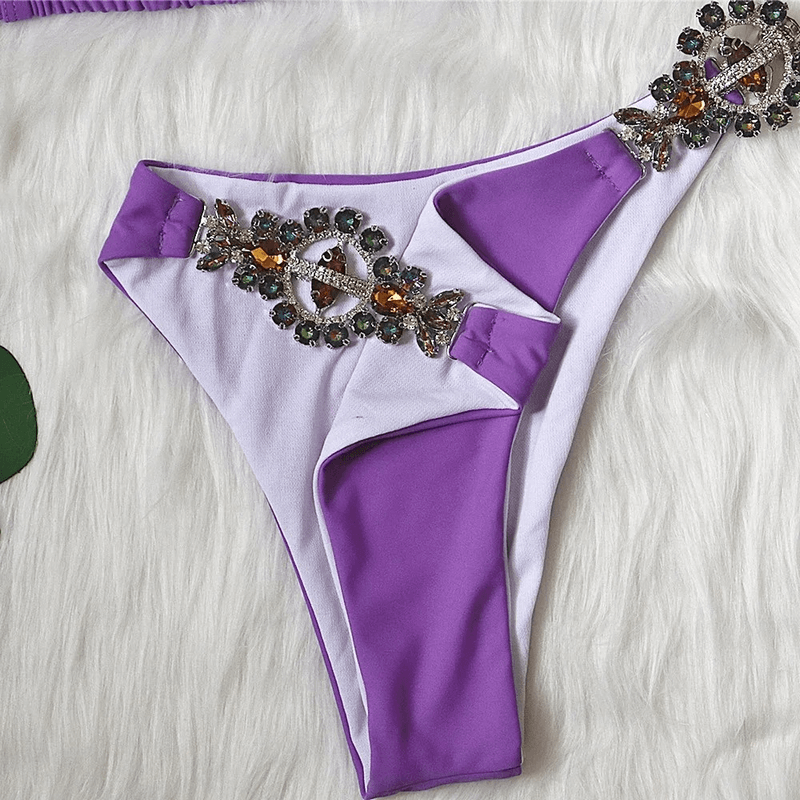 Purple and white bikini bottom with rhinestone embellishments, low waist design, perfect for stylish beachwear.
