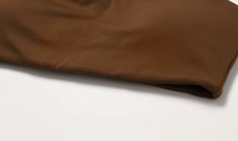 Close-up of brown shockproof yoga sports bra fabric detail, showcasing breathable and elastic material for gym and fitness activities.