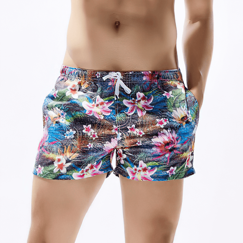 Short colorful men's floral boardshorts for beach with secure waistband and quick-dry fabric, perfect for summer adventures.