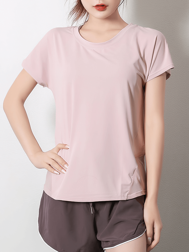 Women's pink short sleeve mesh yoga t-shirt with loose fit and breathable fabric, perfect for active lifestyle and comfort.