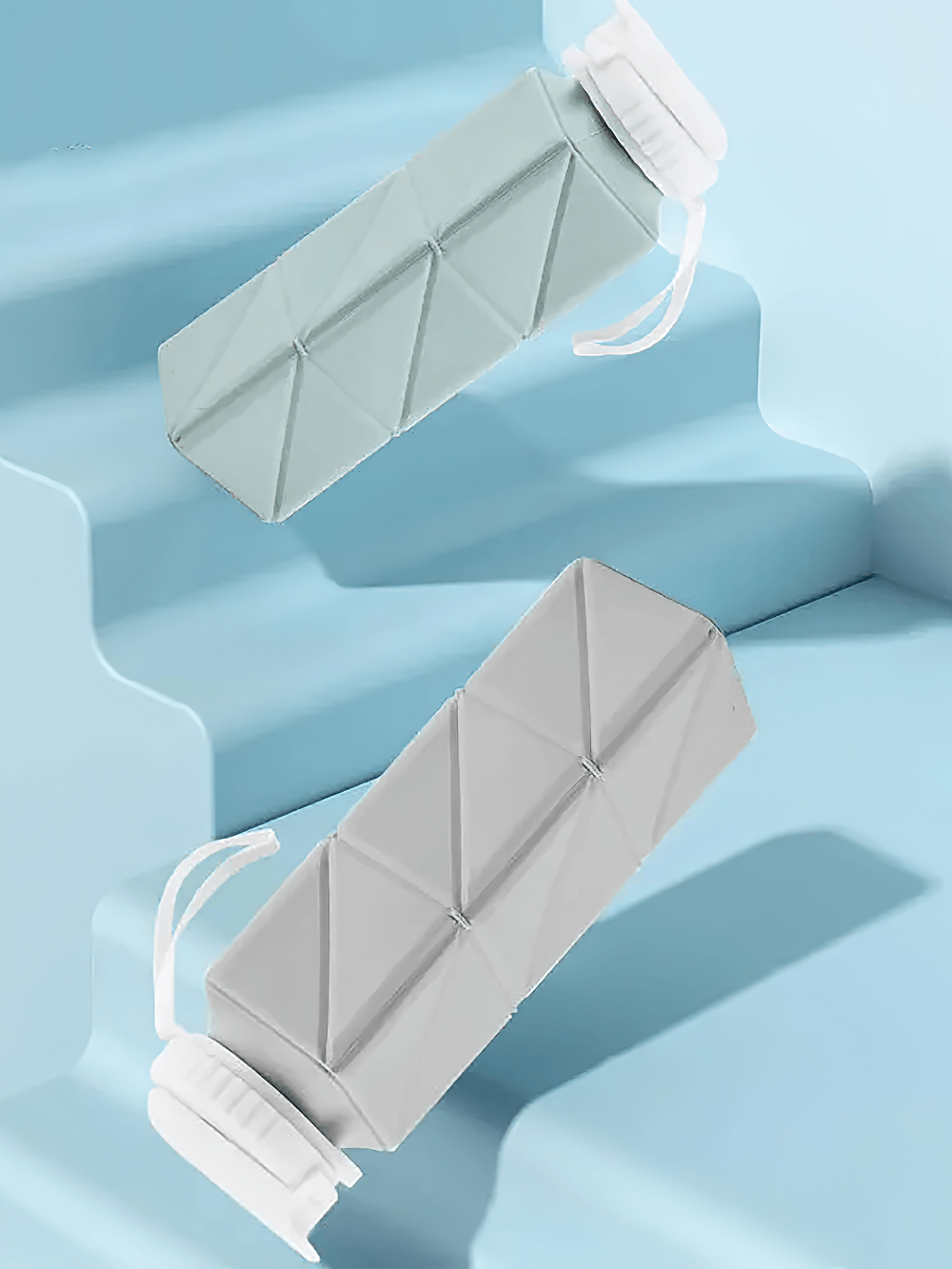 Silicone Collapsible Water Bottle for Travel - SF3483 in teal and gray on stairs, foldable leakproof with straw lid, BPA-free.