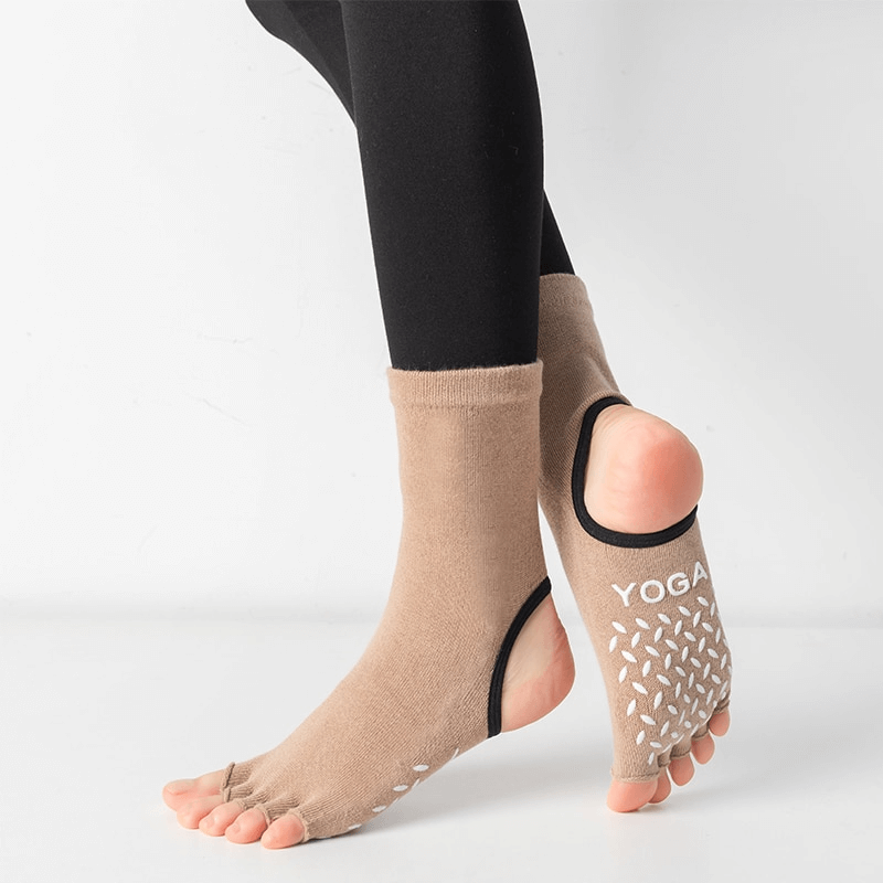 Silicone non-slip toeless pilates socks with five separated toes for yoga, ballet, dance, and fitness. Optimal grip, beige color.