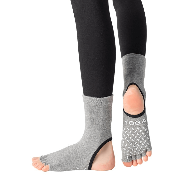 Gray non-slip toeless Pilates socks with five-finger design for yoga, ballet, and fitness, featuring silicone grip on slick surfaces.