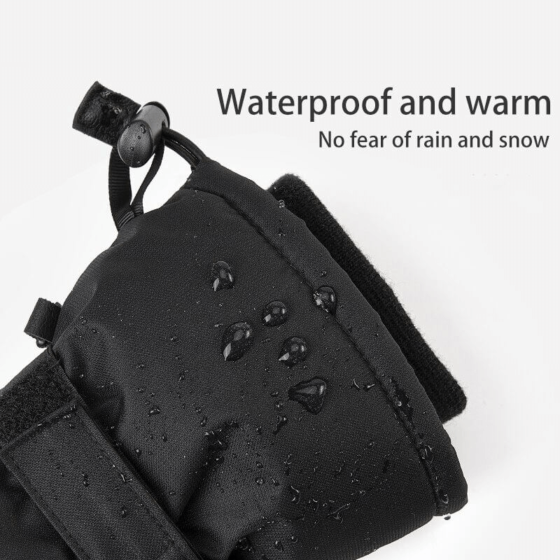 Waterproof black ski gloves with wristbands, showing water droplets to highlight water resistance and warmth.