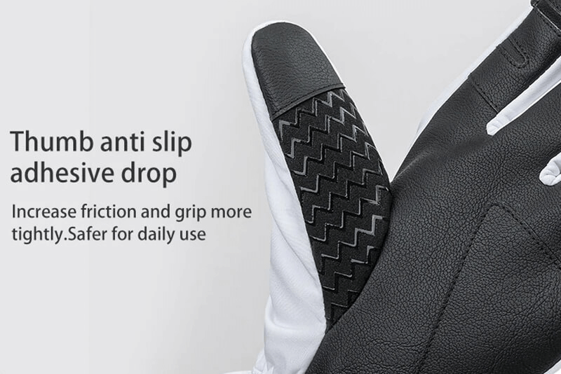Close-up of black ski glove with anti-slip rubber thumb design for better grip and safety.