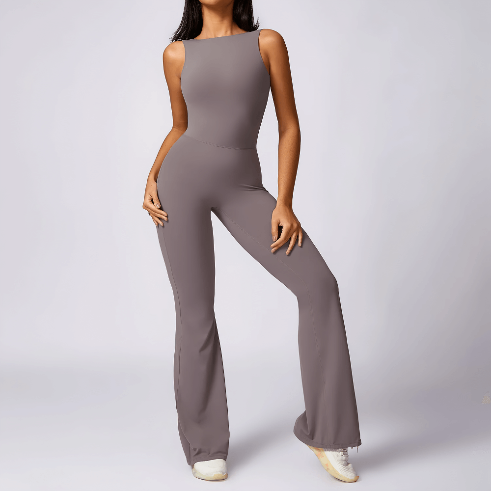 Sleek backless jumpsuit with flared legs for women, perfect for yoga or casual wear. Elegant open-back design in breathable fabric.