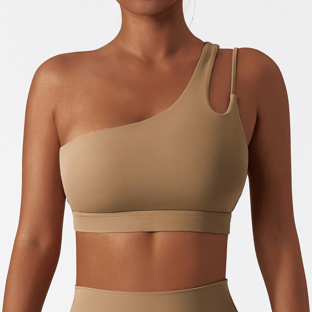 Sleek one-shoulder nylon-spandex sports bra in beige, perfect for running, cycling, and dancing. SF2460 activewear